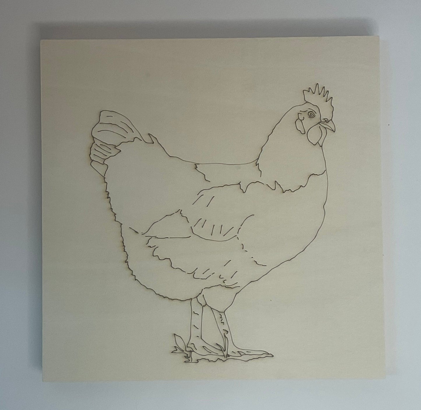 Outline drawing of a chicken on a wood substrate.