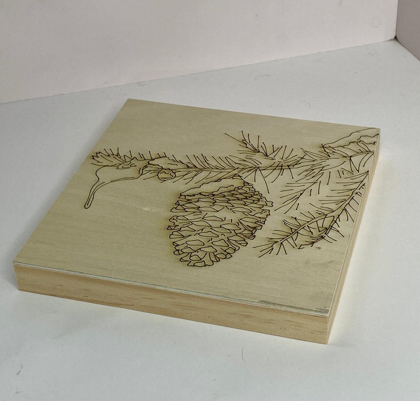 Snowy Pinecone Branch – Engraved Art Base